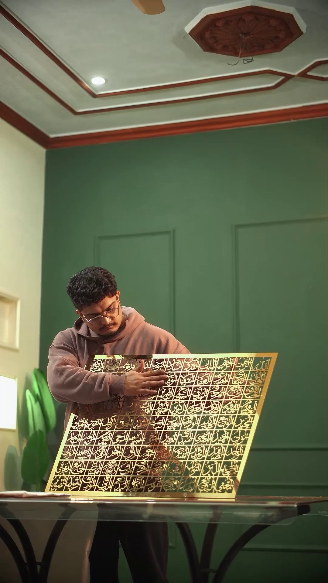 99 Names of Allah gold steel wall art on green wall